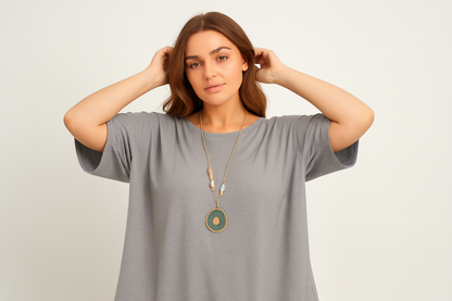 Model with hands in hair showing natural fabric draping
